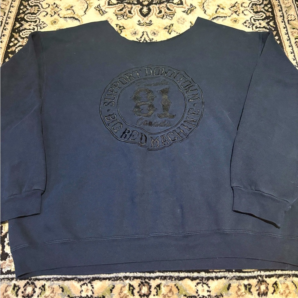 Black off the shoulder street wear sweater.